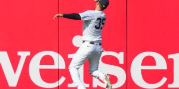 New York Yankees left fielder Cody Bellinger (35) catches a fly ball by Miami Marlins' Xavier Edwards (9) during the ninth inning of a home-opener baseball game, Friday, April 3, 2026, in New York.