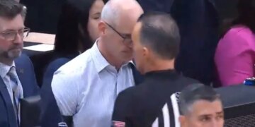 UConn head coach Dan Hurley (l.) puts his forehead on the forehead of referee Roger Ayers (r.) after Huskies freshman Braylon Mullins' game-winning 3-pointer against Duke on March 29, 2026.