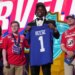 Ohio State linebacker Arvell Reese poses with a New York Giants jersey after being chosen during the NFL football draft.
