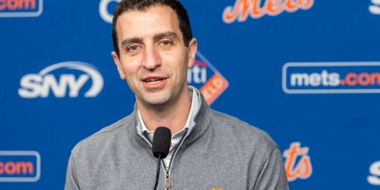 David Stearns speaks into a microphone at a press conference.