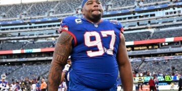 Giants defensive tackle Dexter Lawrence II (97) walking off the field.