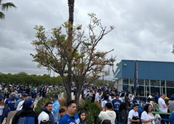 Fans lining up in the rain for a Dodgers-Guardians game.
