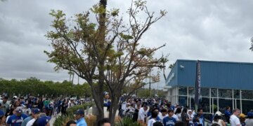 Fans lining up in the rain for a Dodgers-Guardians game.