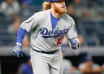 Justin Turner #10 of the Los Angeles Dodgers running up the first base line.