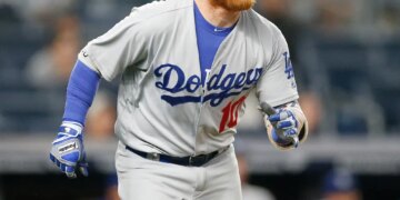 Justin Turner #10 of the Los Angeles Dodgers running up the first base line.