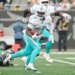 Miami Dolphins running back De'Von Achane #28 runs the ball during the first quarter.