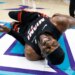 Heat center Bam Adebayo writhes in pain after getting tripped by the Hornets' LaMelo Ball in the second quarter on April 14, 2026.