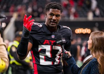 Atlanta Falcons linebacker James Pearce Jr. being interviewed after a football game.
