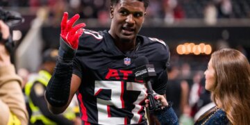 Atlanta Falcons linebacker James Pearce Jr. being interviewed after a football game.