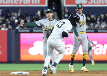 Second baseman Jeff McNeil throws to first to complete a double play after orcing out Jazz Chisholm Jr. during the sixth inning of the Yankees' 5-3 win over the A's on April 7, 2026 at the Stadium.