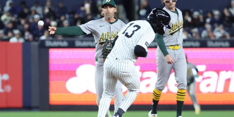Second baseman Jeff McNeil throws to first to complete a double play after orcing out Jazz Chisholm Jr. during the sixth inning of the Yankees' 5-3 win over the A's on April 7, 2026 at the Stadium.