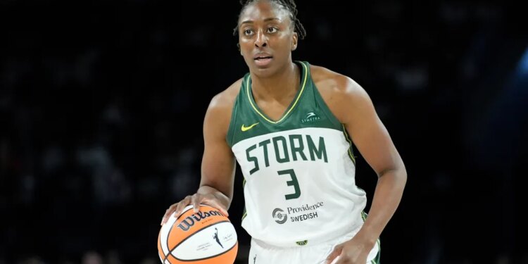 Seattle Storm forward Nneka Ogwumike dribbling a basketball.