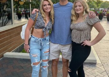 Former Wisconsin Badgers tight end Jack Pugh with two women.