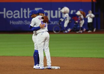Bo Bichette and Marcus Semien hug after the Mets beat the Twins on April 22, 2026.