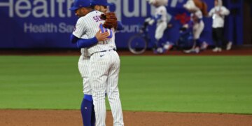 Bo Bichette and Marcus Semien hug after the Mets beat the Twins on April 22, 2026.