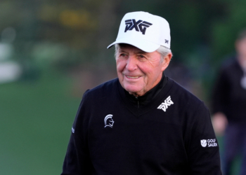 Gary Player reacting after teeing off at the Masters Tournament.