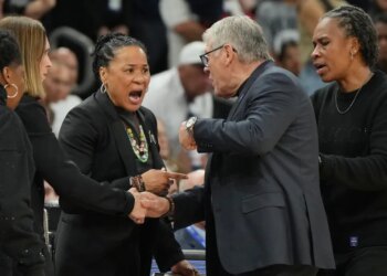 South Carolina head coach Dawn Staley, left, and UConn head coach Geno Auriemma argue after a woman's NCAA college basketball tournament semifinal game at the Final Four, Friday, April 3, 2026, in Phoenix.