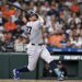 New York Yankees designated hitter Giancarlo Stanton (27) hits the ball in the third inning against the Houston Astros at Daikin Park.