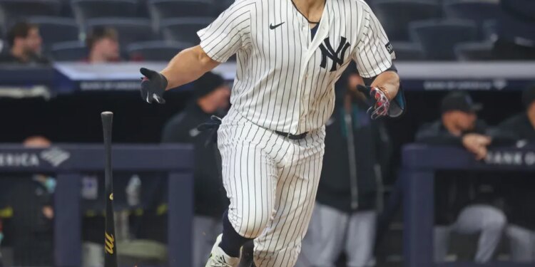 New York Yankees designated hitter Giancarlo Stanton hits a single during the 7th inning.
