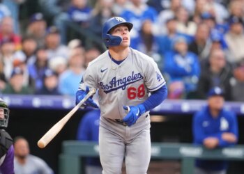 Dalton Rushing looking up after a swing with a bat in his hands.