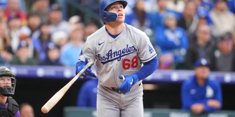 Dalton Rushing looking up after a swing with a bat in his hands.