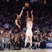 Atlanta Hawks guard CJ McCollum #3 puts up a shot as New York Knicks guard Landry Shamet #44 jumps to defend during the first quarter.