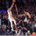 Atlanta Hawks guard CJ McCollum #3 puts up a shot over New York Knicks forward Og Anunoby #8 during the fourth quarter.
