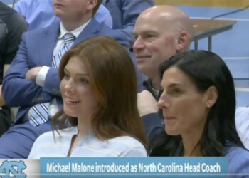 Mike Malone's daughter Bridget (L) and his wife Jocelyn (R) at his introductory press conference after taking the head coach job at UNC on April 7, 2026.