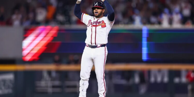 Dominic Smith reacting at second base after hitting a bases-clearing double.