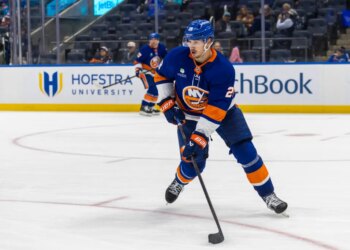 Alexander Romanov #28 of the New York Islanders moves the puck down ice during the second period at UBS Arena, Monday, Oct. 13, 2025, in Elmont, NY.