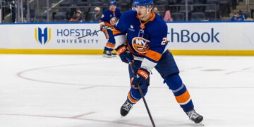 Alexander Romanov #28 of the New York Islanders moves the puck down ice during the second period at UBS Arena, Monday, Oct. 13, 2025, in Elmont, NY.