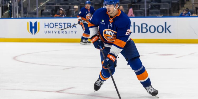 Alexander Romanov #28 of the New York Islanders moves the puck down ice during the second period at UBS Arena, Monday, Oct. 13, 2025, in Elmont, NY.