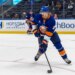 Alexander Romanov #28 of the New York Islanders moves the puck down ice during the second period at UBS Arena, Monday, Oct. 13, 2025, in Elmont, NY.
