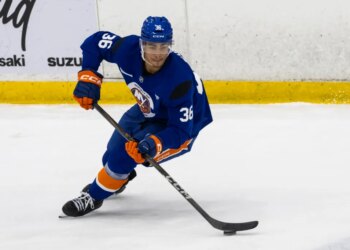 New York Islanders defenseman Isaiah George (36) skates during practice.