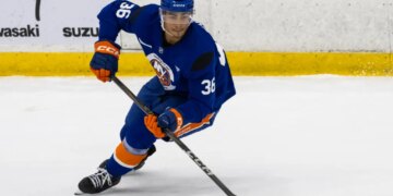 New York Islanders defenseman Isaiah George (36) skates during practice.