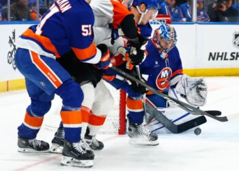New York Islanders goaltender Ilya Sorokin (30) makes a save against the Philadelphia Flyers during the second period of an NHL hockey game, Friday, April 3, 2026 in Elmont, N.Y.