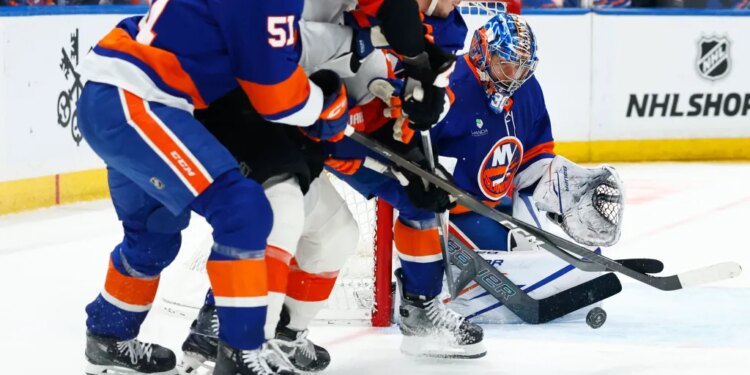 New York Islanders goaltender Ilya Sorokin (30) makes a save against the Philadelphia Flyers during the second period of an NHL hockey game, Friday, April 3, 2026 in Elmont, N.Y.