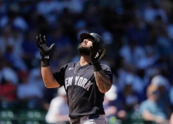 Jasson Domínguez of the New York Yankees looking up after hitting a home run.