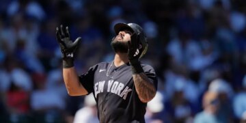 Jasson Domínguez of the New York Yankees looking up after hitting a home run.