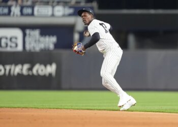 New York Yankees second baseman Jazz Chisholm Jr. (13) throws a baseball during the sixth inning at Yankee Stadium.