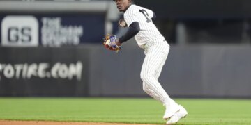 New York Yankees second baseman Jazz Chisholm Jr. (13) throws a baseball during the sixth inning at Yankee Stadium.