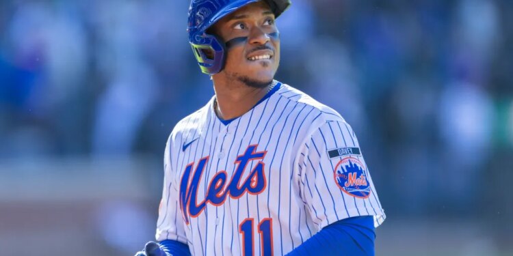New York Mets second baseman Jorge Polanco (11) reacts as he walks back to the dugout after he flies out for the final out of the tenth inning at Citi Field, Sunday, March 29, 2026,
