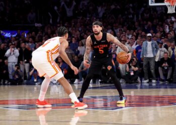 Knicks guard Jose Alvarado #5 and Atlanta Hawks guard Gabe Vincent #4 face off during the third quarter.
