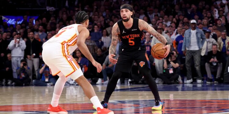 Knicks guard Jose Alvarado #5 and Atlanta Hawks guard Gabe Vincent #4 face off during the third quarter.
