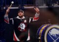 Buffalo Bills quarterback Josh Allen hyping up the crowd at a Buffalo Sabres game.