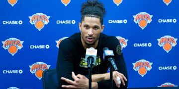 Josh Hart #3, speaking to the media after practice at the New York Knicks training facility in Tarrytown, New York.