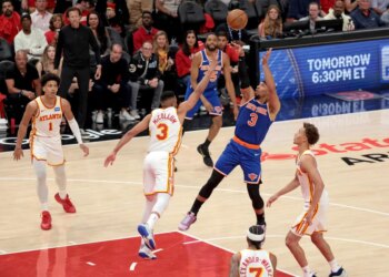 New York Knicks guard Josh Hart (3) shoots while Atlanta Hawks guard CJ McCollum (3) defends during Game 3 of the NBA Playoffs.