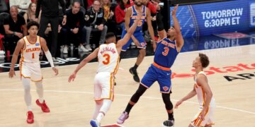 New York Knicks guard Josh Hart (3) shoots while Atlanta Hawks guard CJ McCollum (3) defends during Game 3 of the NBA Playoffs.