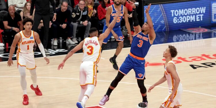 New York Knicks guard Josh Hart (3) shoots while Atlanta Hawks guard CJ McCollum (3) defends during Game 3 of the NBA Playoffs.
