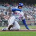 Juan Soto of the New York Mets sliding into home plate.